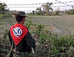 A file photo of a Burmese border guard looking across to Bangladesh. (PHOTO: DVB TV)