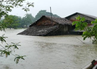 A prisoner shackled on both of his legs carries a granite stone at a rock quarry run by the prison department in Paung Township in Mon State. (Photo: Swe Win / Myanmar Now)
